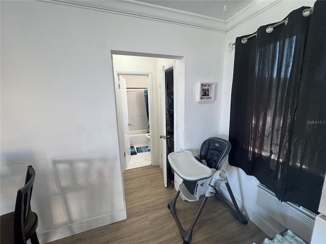 interior space with crown molding and hardwood / wood-style floors