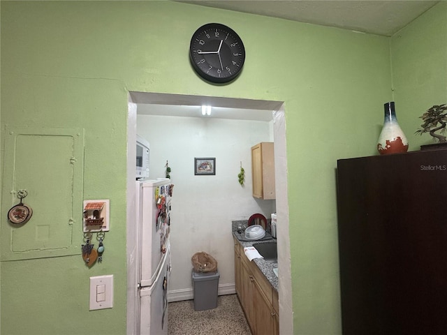 kitchen featuring white refrigerator