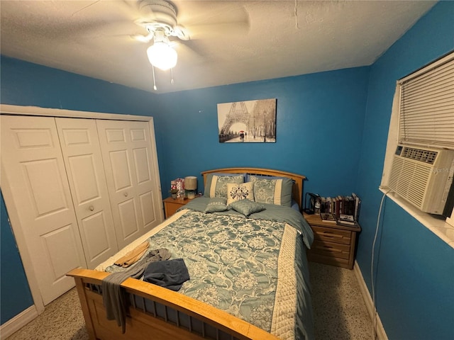 bedroom with a closet, ceiling fan, and cooling unit