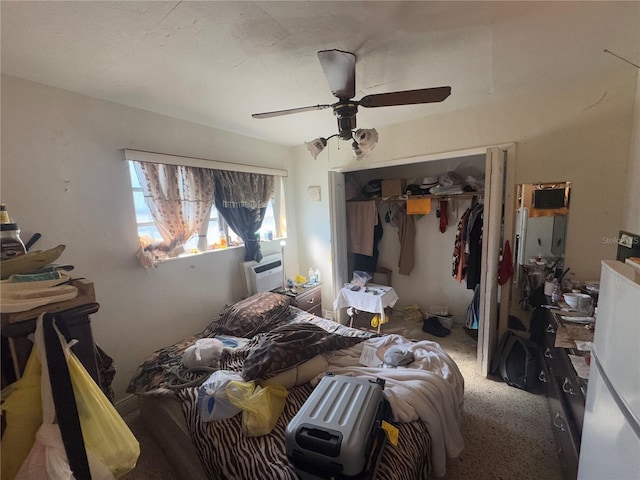 bedroom featuring carpet, ceiling fan, cooling unit, and a closet