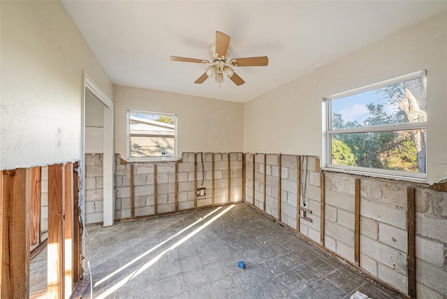 empty room with plenty of natural light and ceiling fan