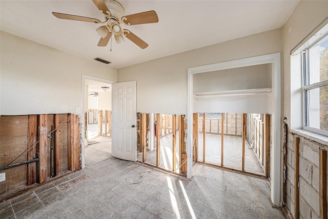 interior space with a closet and ceiling fan