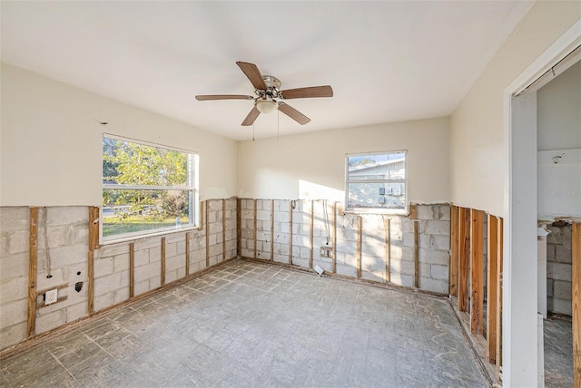 unfurnished room with ceiling fan