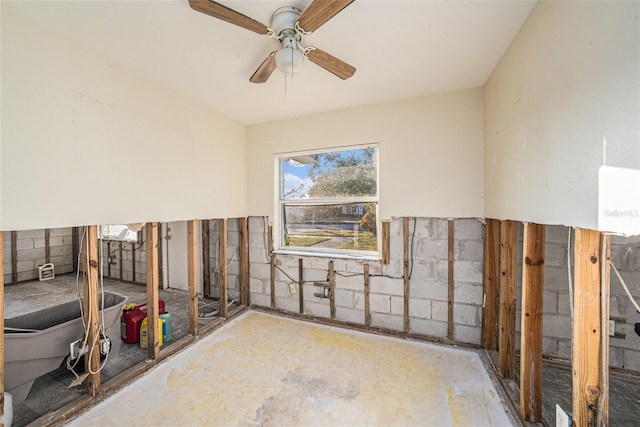 interior space with ceiling fan