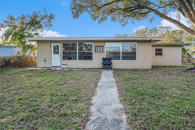 rear view of house with a yard