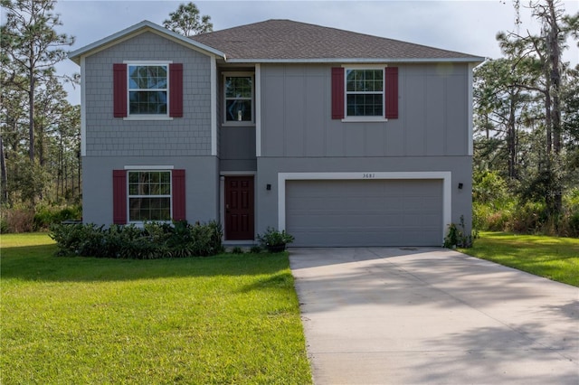 view of front of house with a garage and a front lawn