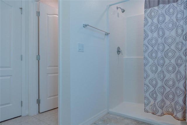 bathroom featuring tile patterned floors and walk in shower