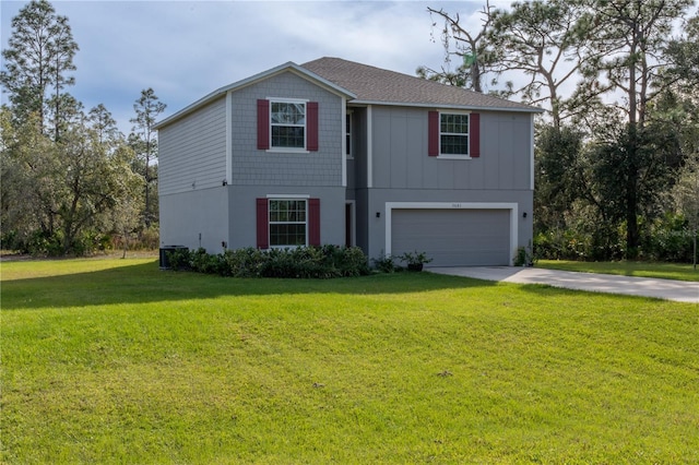 view of front of property featuring a garage and a front lawn