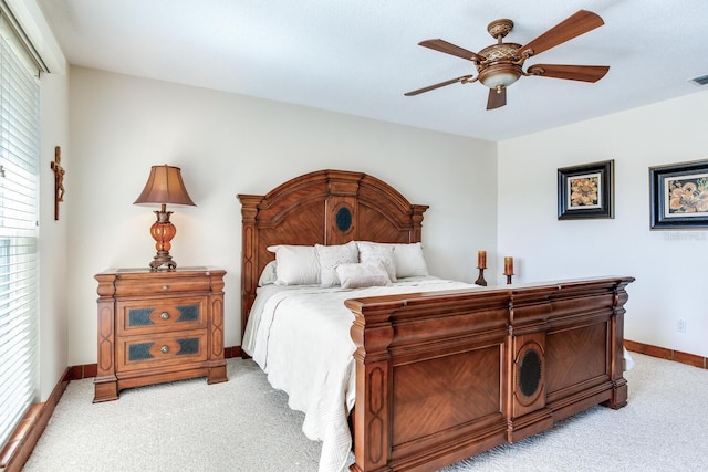 bedroom with light carpet and ceiling fan