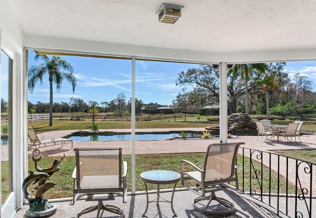 sunroom with a water view