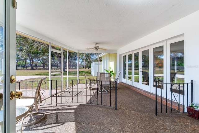 sunroom / solarium with ceiling fan