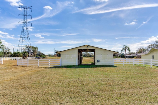 view of outbuilding featuring a yard and a rural view