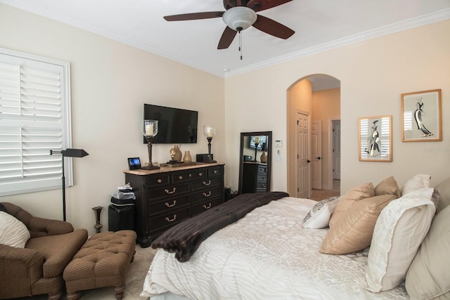 bedroom featuring ornamental molding and ceiling fan