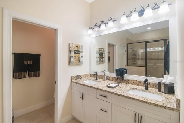 bathroom with tile patterned flooring, vanity, and a shower with shower door