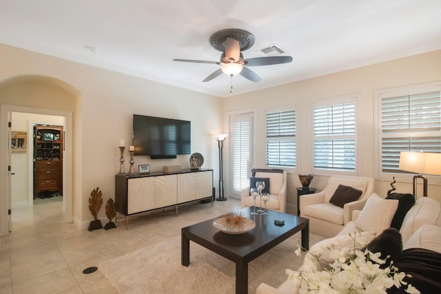 living room featuring light tile patterned floors and ceiling fan