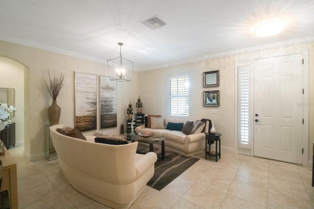 tiled living room featuring crown molding and an inviting chandelier