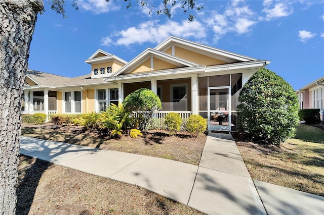 view of front of house featuring a sunroom