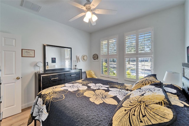 bedroom with light wood-type flooring and ceiling fan