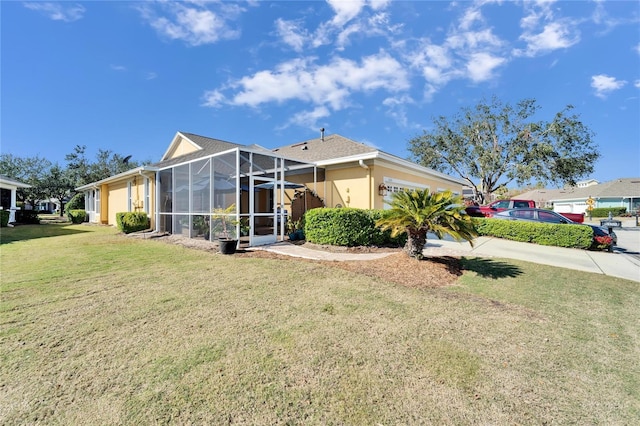 view of front facade featuring glass enclosure and a front lawn