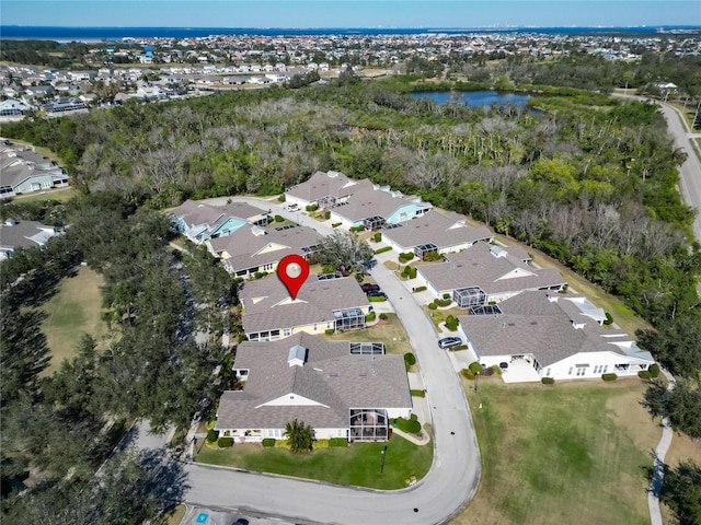 birds eye view of property with a water view