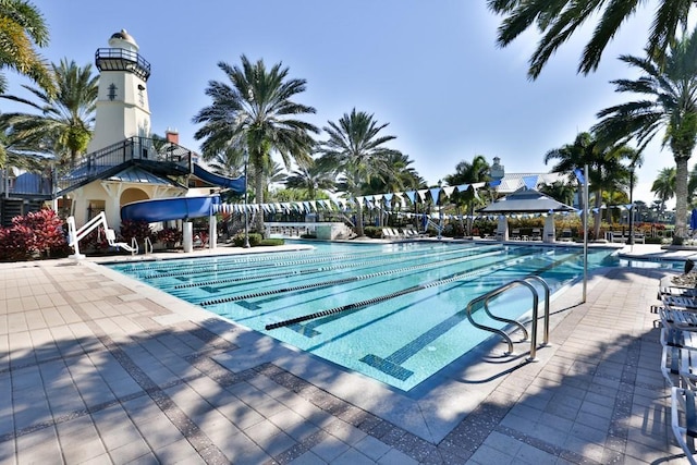 view of pool with a gazebo and a water slide