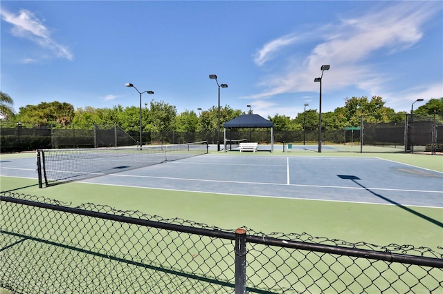 view of tennis court featuring a gazebo and basketball court