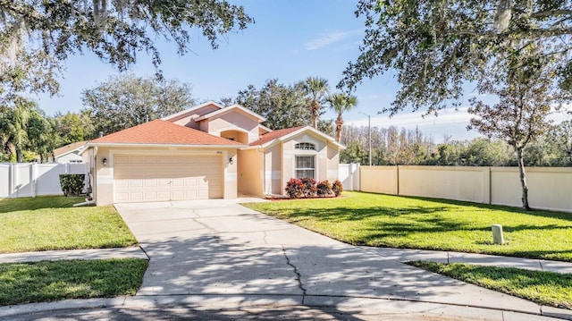 mediterranean / spanish-style house with a front yard and a garage