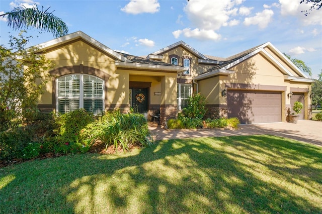 view of front of property featuring a garage and a front lawn