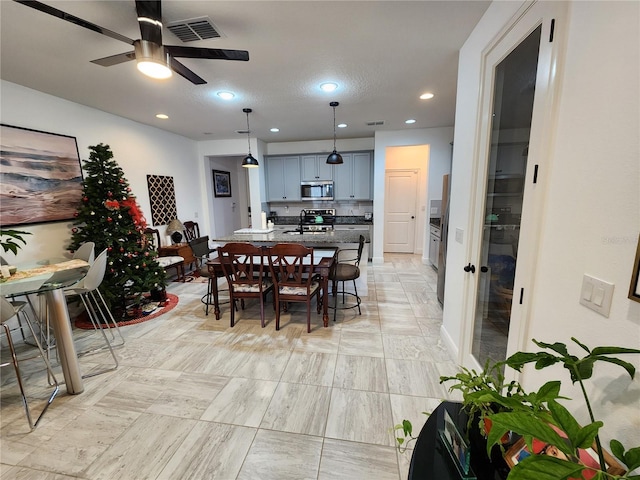 dining room with ceiling fan