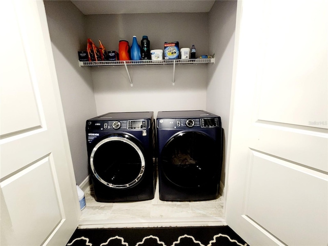 laundry room featuring separate washer and dryer