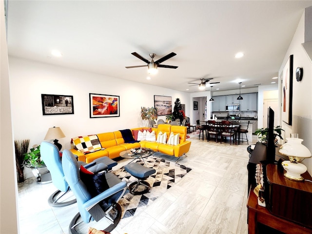 living room with ceiling fan