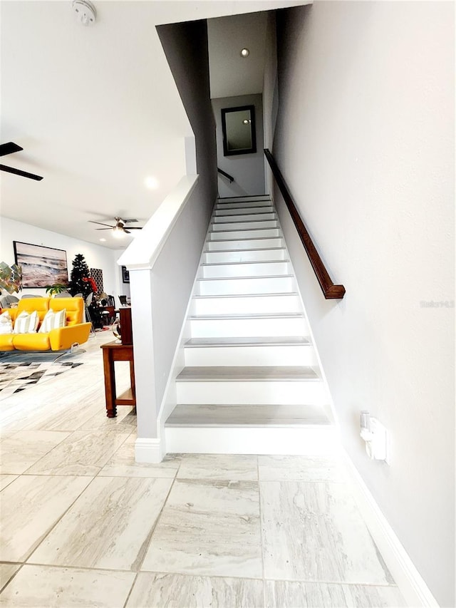 stairway with ceiling fan