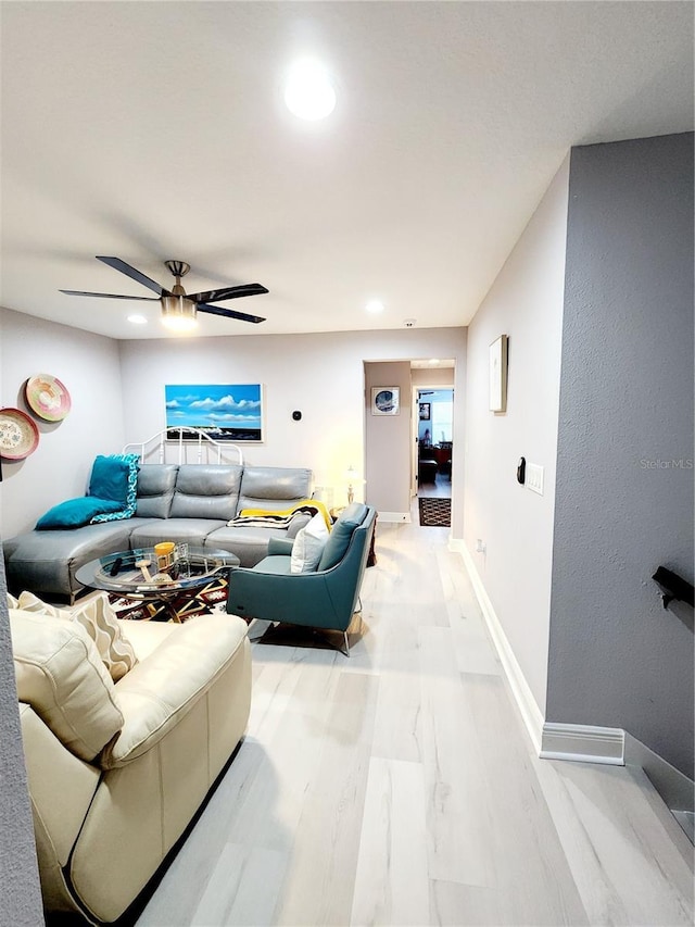 living room with ceiling fan