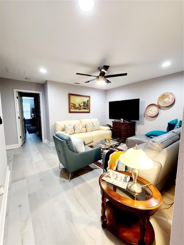 living room with ceiling fan