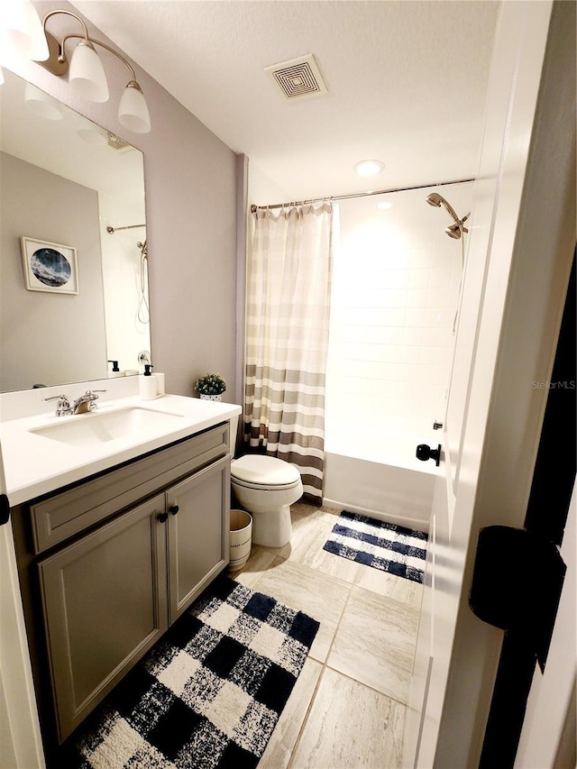 full bathroom featuring toilet, vanity, and shower / bath combo