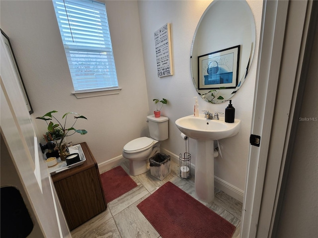 bathroom with toilet and sink