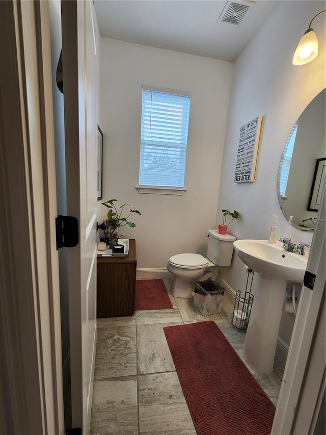 bathroom with toilet and sink