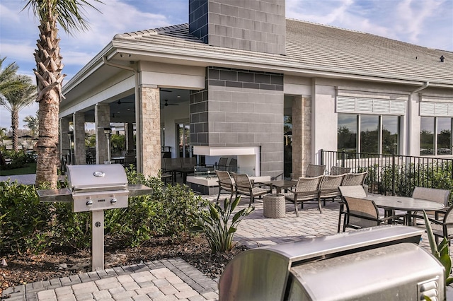 view of patio / terrace with ceiling fan and area for grilling