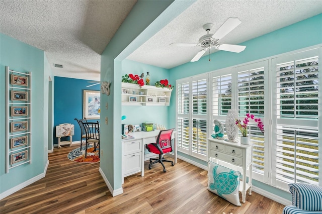 office with wood-type flooring, a textured ceiling, and ceiling fan