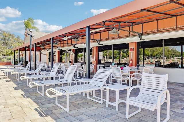 view of patio / terrace featuring ceiling fan