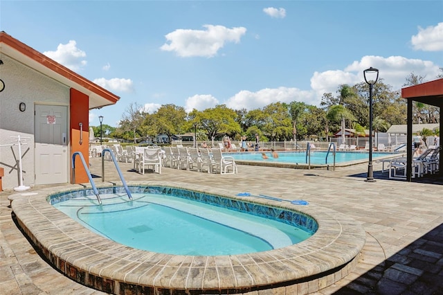 view of swimming pool featuring a patio