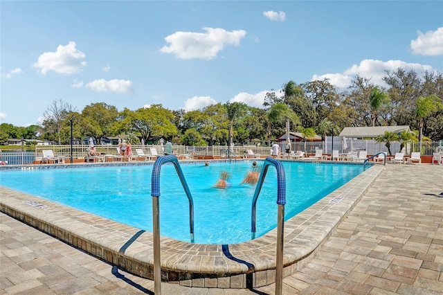 view of swimming pool with a patio area