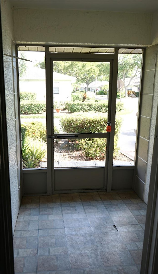 unfurnished sunroom with a healthy amount of sunlight