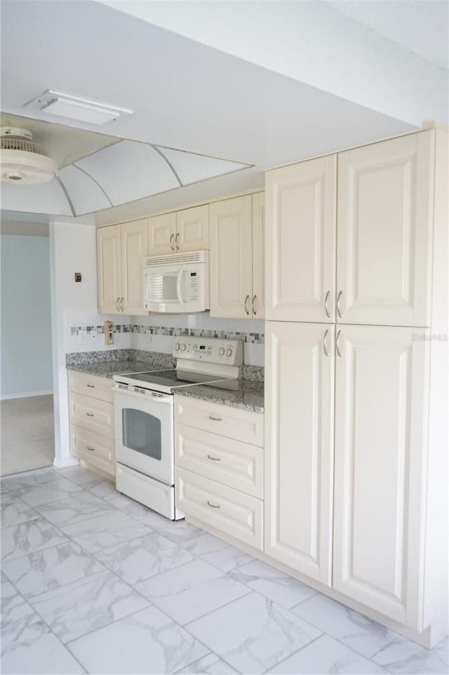 kitchen with white appliances and backsplash