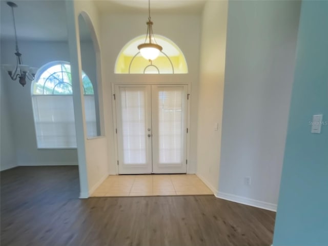 entryway featuring french doors and wood-type flooring