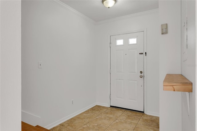 foyer entrance with light tile patterned floors and ornamental molding