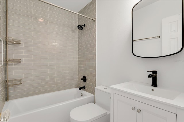 full bathroom with tiled shower / bath combo, vanity, and toilet