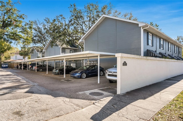 view of property exterior featuring a carport