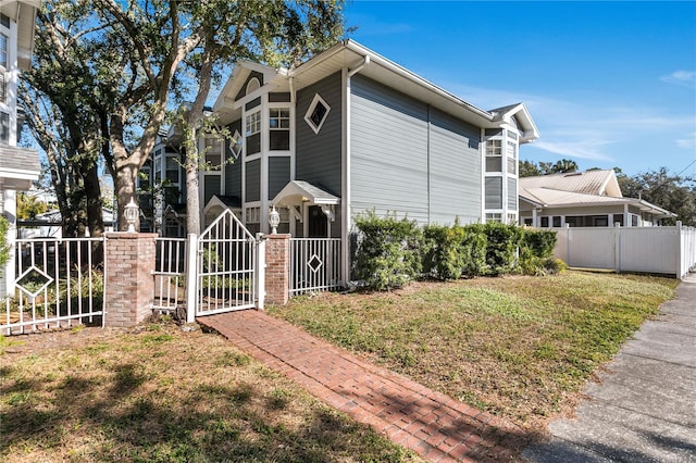 view of property exterior with a yard