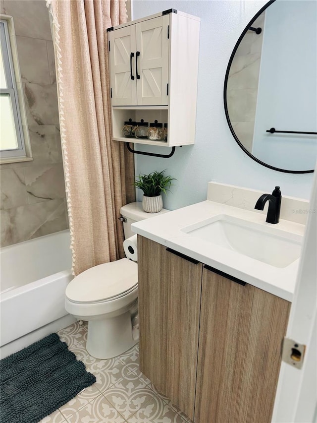 full bathroom featuring tile patterned flooring, shower / tub combo with curtain, vanity, and toilet